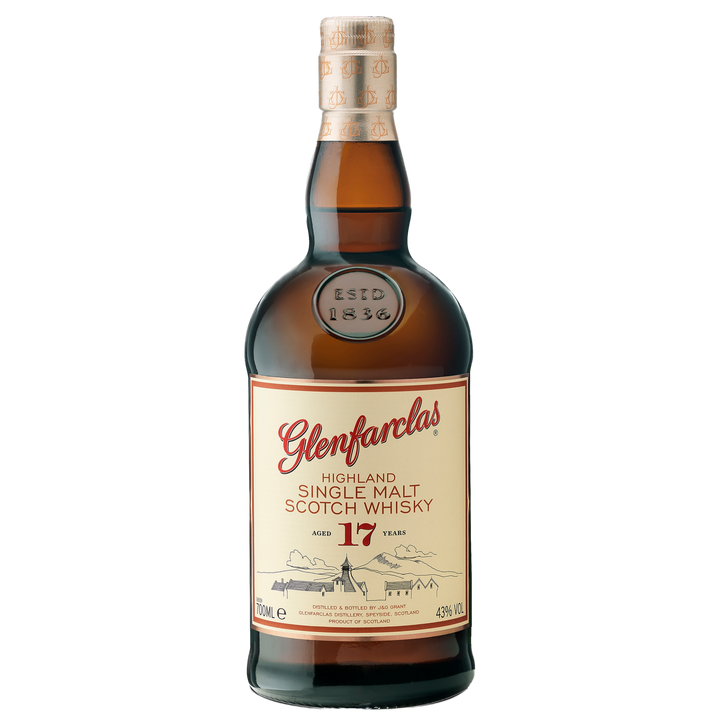 A bottle of Glenfarclas 17 Year Old Single Malt Scotch Whisky featuring a cream label with red and gold text, hills illustrated in the background, and sealed with a tan cork.