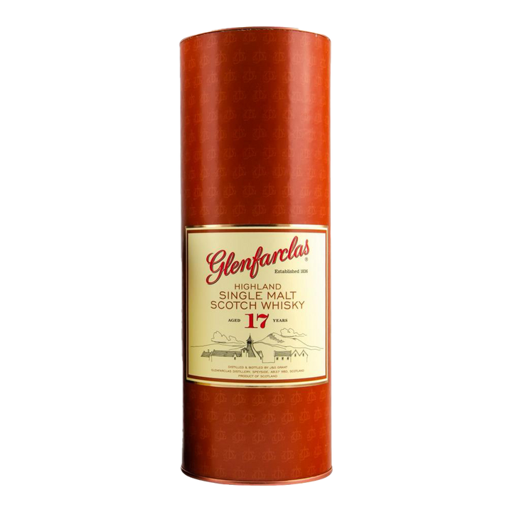 A cylindrical red container of Glenfarclas 17 Year Old Single Malt Scotch Whisky, with a gold and cream label featuring red lettering.