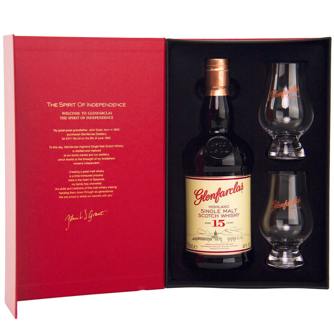 The Glenfarclas 15 Year Old Limited Release Gift Pack includes a bottle and two branded glasses in a striking red box, featuring detailed whisky information on the inside cover.