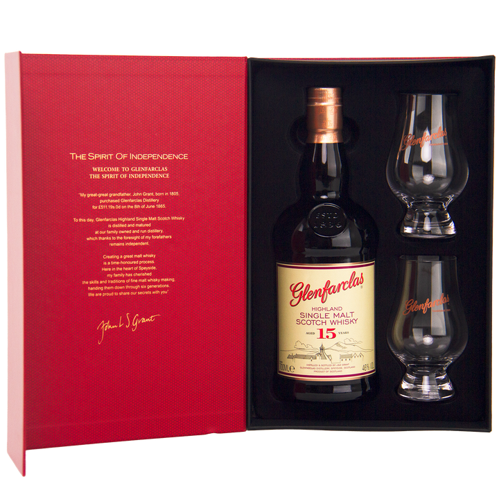 The Glenfarclas 15 Year Old Limited Release Gift Pack includes a bottle and two branded glasses in a striking red box, featuring detailed whisky information on the inside cover.