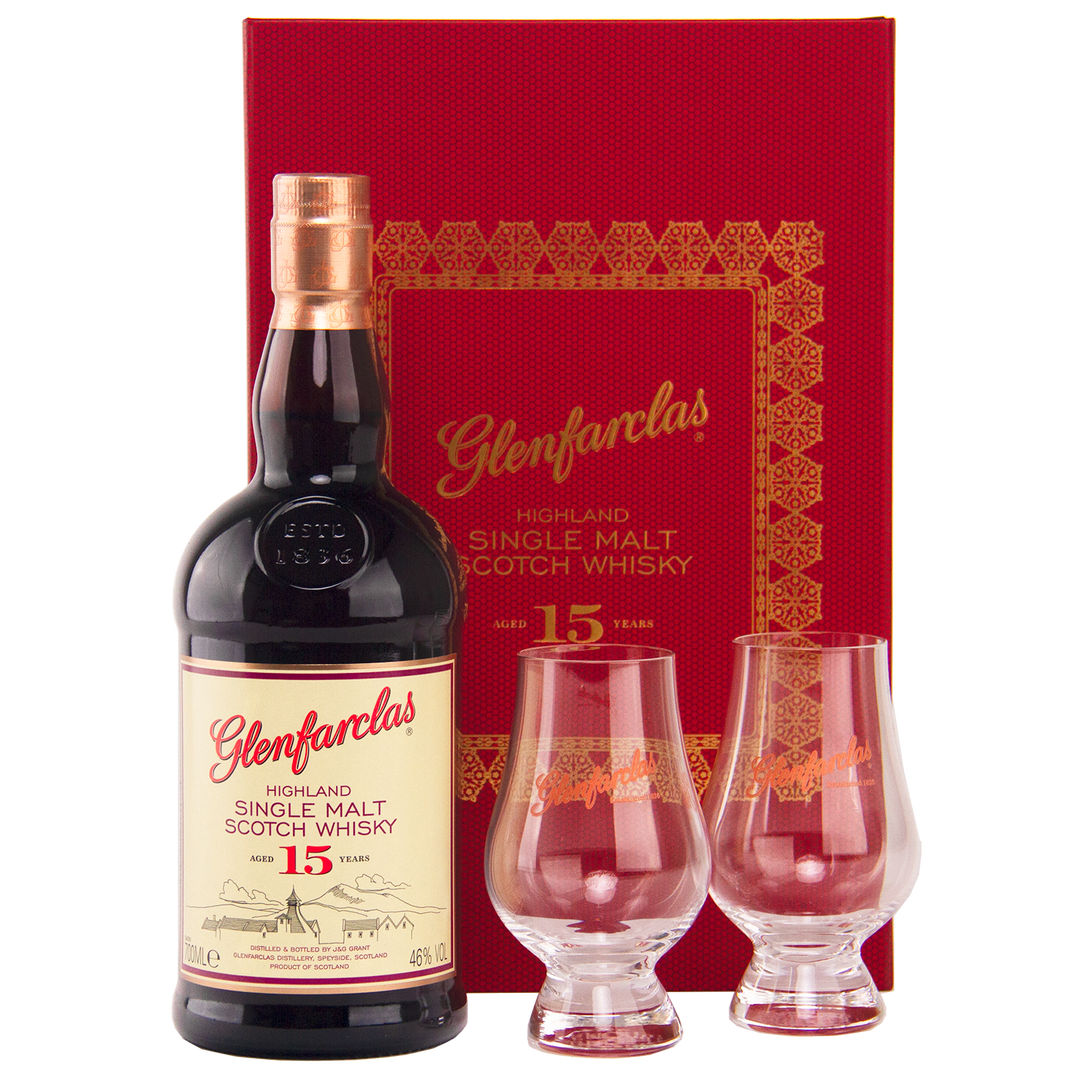 The Glenfarclas 15 Year Old Limited Release Gift Pack includes a bottle of 15 Year Old single malt whisky and two Glencairn glasses, presented in front of a striking red and gold Glenfarclas gift box.