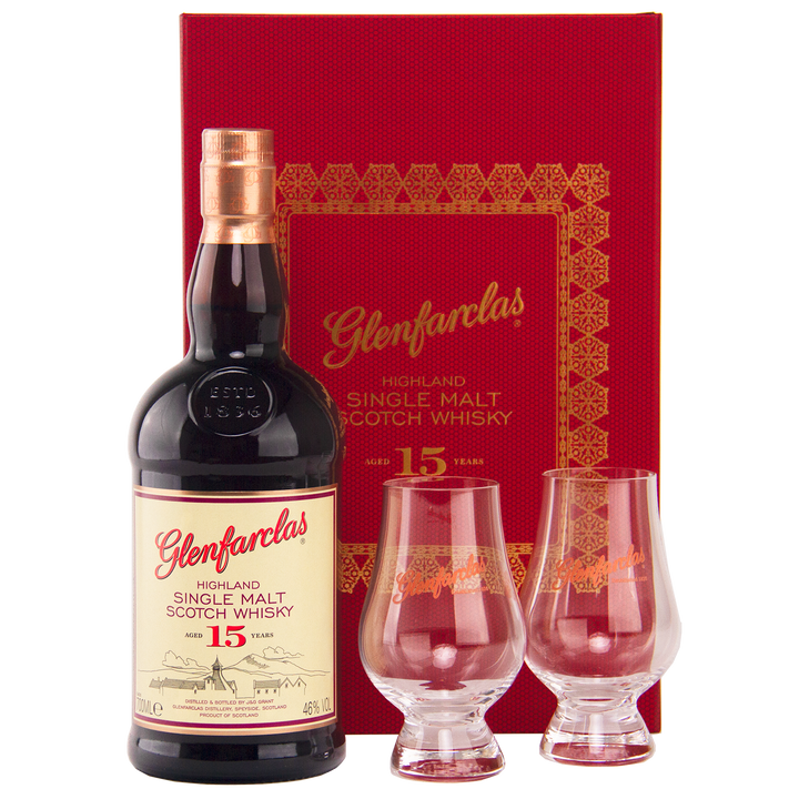 The Glenfarclas 15 Year Old Limited Release Gift Pack includes a bottle of 15 Year Old single malt whisky and two Glencairn glasses, presented in front of a striking red and gold Glenfarclas gift box.