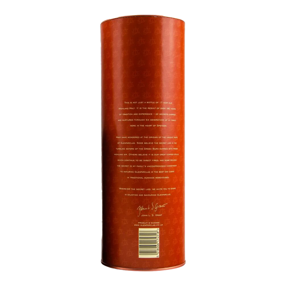 A tall, cylindrical orange container with gold text and a signature is shown from the back. This is Glenfarclas 17 year old Single Malt Scotch Whisky, featuring small white writing near the bottom against a plain white background.
