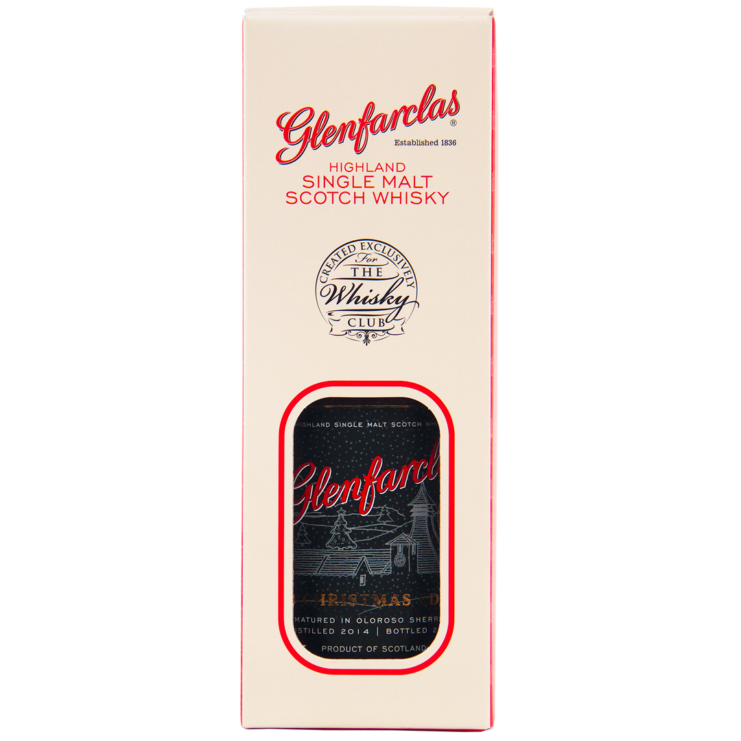 A cream and red box of Glenfarclas 2024 Christmas Edition Single Malt Whisky with a cutout window displaying the bottle and label, featuring The Whisky Club logo. Matured in Oloroso sherry cask for a rich finish.