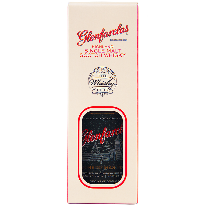 A cream and red box of Glenfarclas 2024 Christmas Edition Single Malt Whisky with a cutout window displaying the bottle and label, featuring The Whisky Club logo. Matured in Oloroso sherry cask for a rich finish.