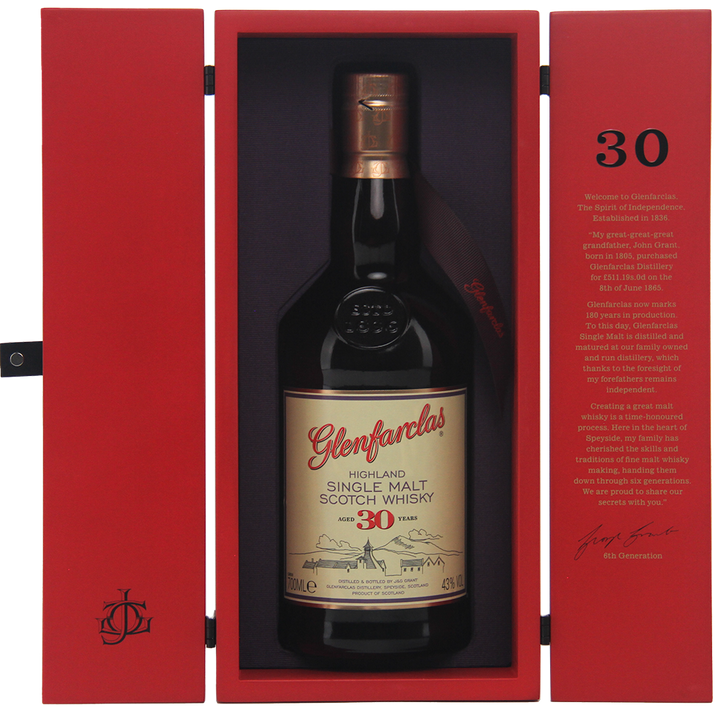 A bottle of Glenfarclas 30 Year Old stands upright in an open red box, showcasing gold and black labels and inside lid text that highlights this acclaimed Speyside single malt.