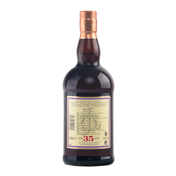 A 700ml dark brown glass bottle of Glenfarclas 35 Year Old Single Malt Scotch Whisky, matured in sherry cask, features a gold and copper cap and cream-colored label with text and symbols on the back showing its 35-year aging.
