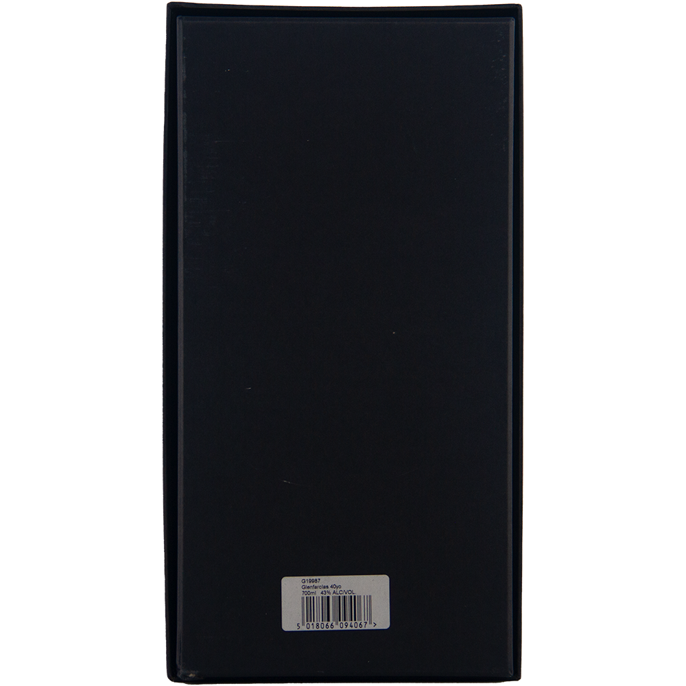The image shows the back of a rectangular black box of Glenfarclas 40 year old Single Malt Scotch Whisky, featuring a white barcode sticker at the bottom center against a plain, light-colored background.