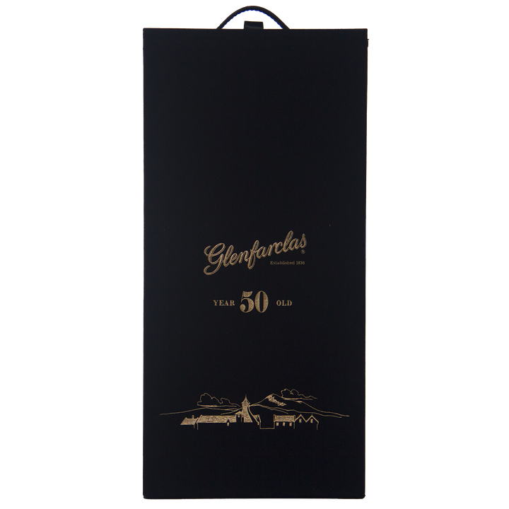 A black box with gold text reading Glenfarclas 50 year old Single Malt Scotch Whisky, Established 1836, plus a gold distillery and landscape illustration—honoring the legacy of this famed Highland sherried single malt.