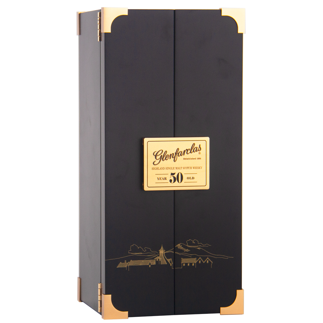 A tall, rectangular black box with gold accents and a plaque reading "Glenfarclas 50 year old Single Malt Scotch Whisky." A gold landscape illustration on the front emphasizes this iconic Highland whisky’s esteemed heritage.