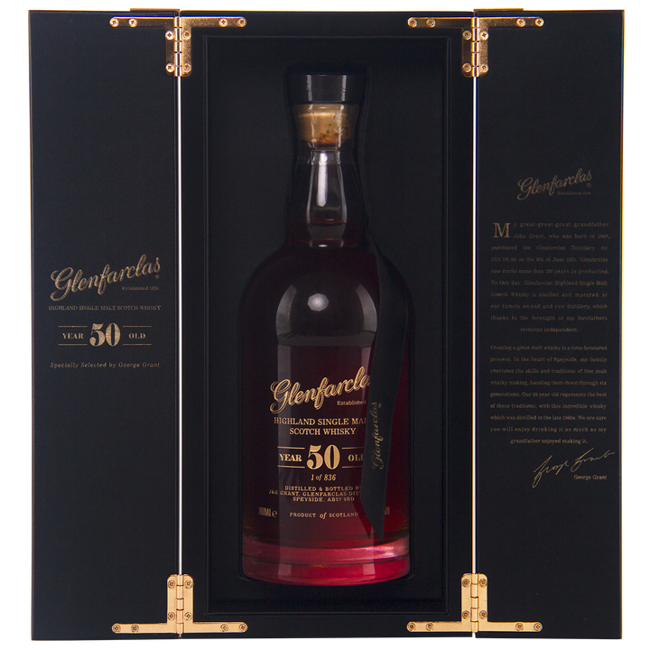A bottle of Glenfarclas 50 Year Old Single Malt Scotch Whisky, displayed upright in an open black and gold box with gold hinges and inner text, highlighting this exceptional sherried single malt.