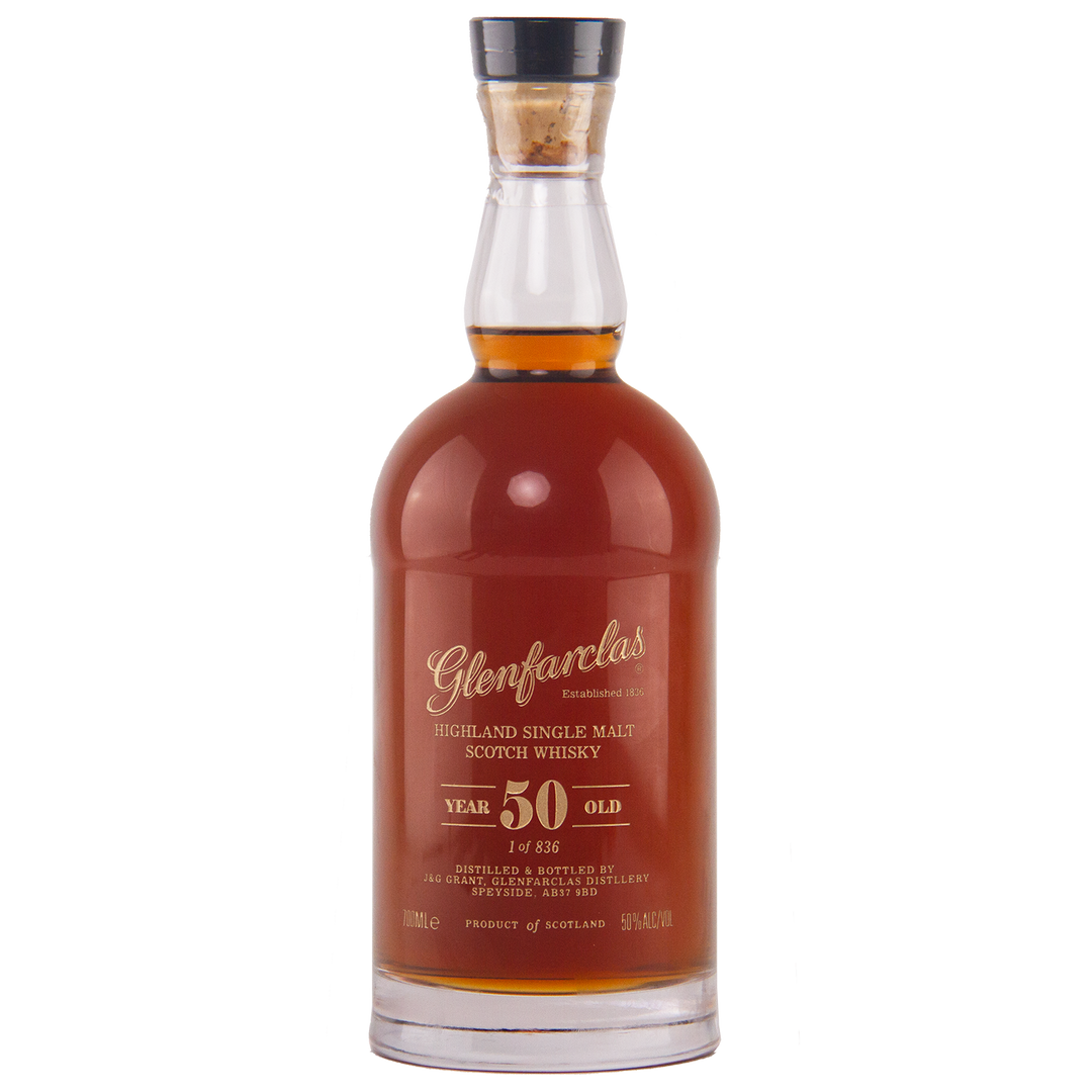A bottle of Glenfarclas 50 Year Old Single Malt Scotch Whisky, featuring deep amber liquid and gold lettering that showcases its impressive age—an outstanding example of a sherried Highland single malt.