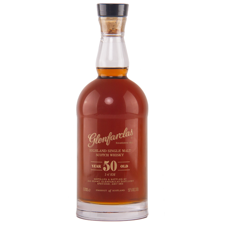 A bottle of Glenfarclas 50 Year Old Single Malt Scotch Whisky, featuring deep amber liquid and gold lettering that showcases its impressive age—an outstanding example of a sherried Highland single malt.