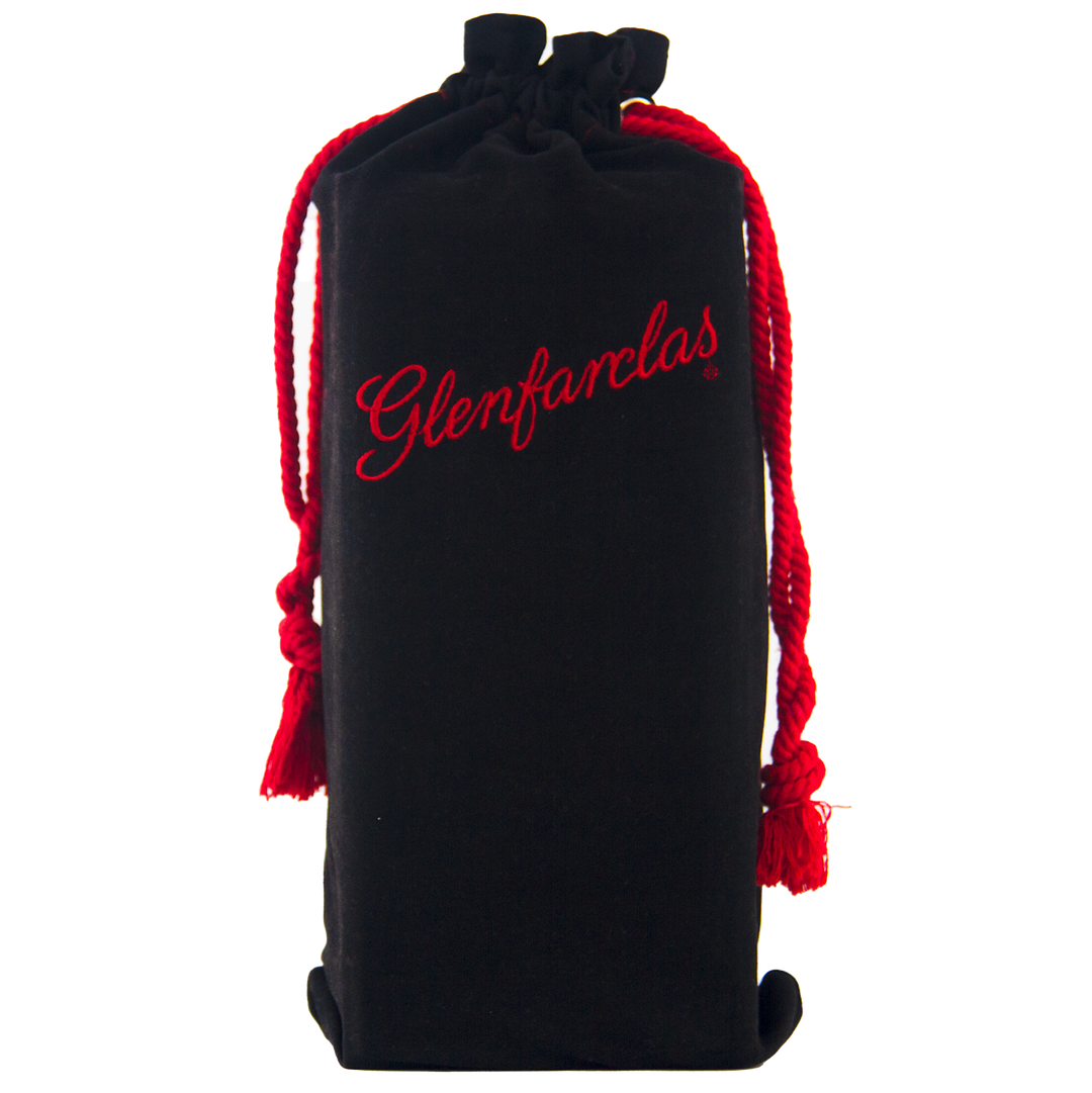 A black velvet pouch with "Glenfarclas" in red script and red drawstrings, standing upright against a plain background—perfect for presenting the Glenfarclas 1956 58 Year Old Sherry Cask Strength whisky.