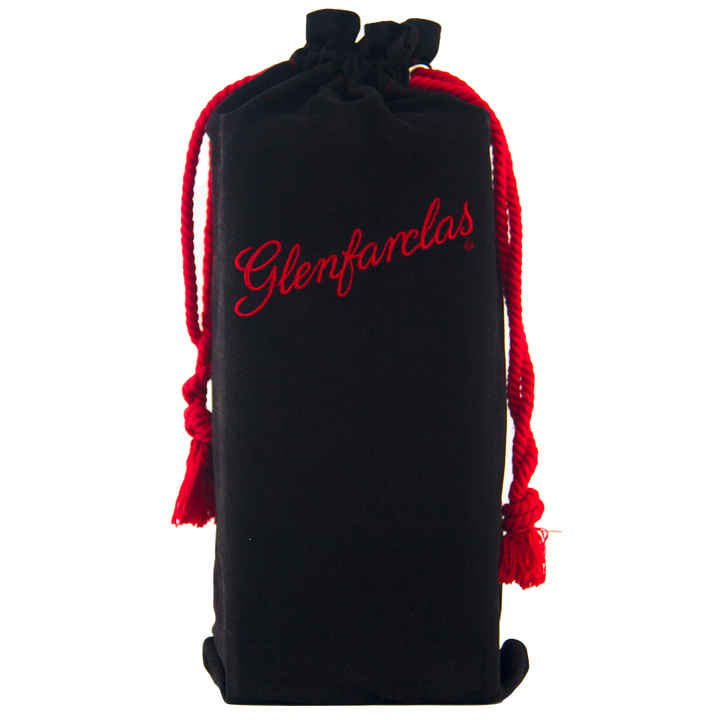A black velvet pouch with "Glenfarclas" in red script and red drawstrings, standing upright against a plain background—perfect for presenting the Glenfarclas 1956 58 Year Old Sherry Cask Strength whisky.