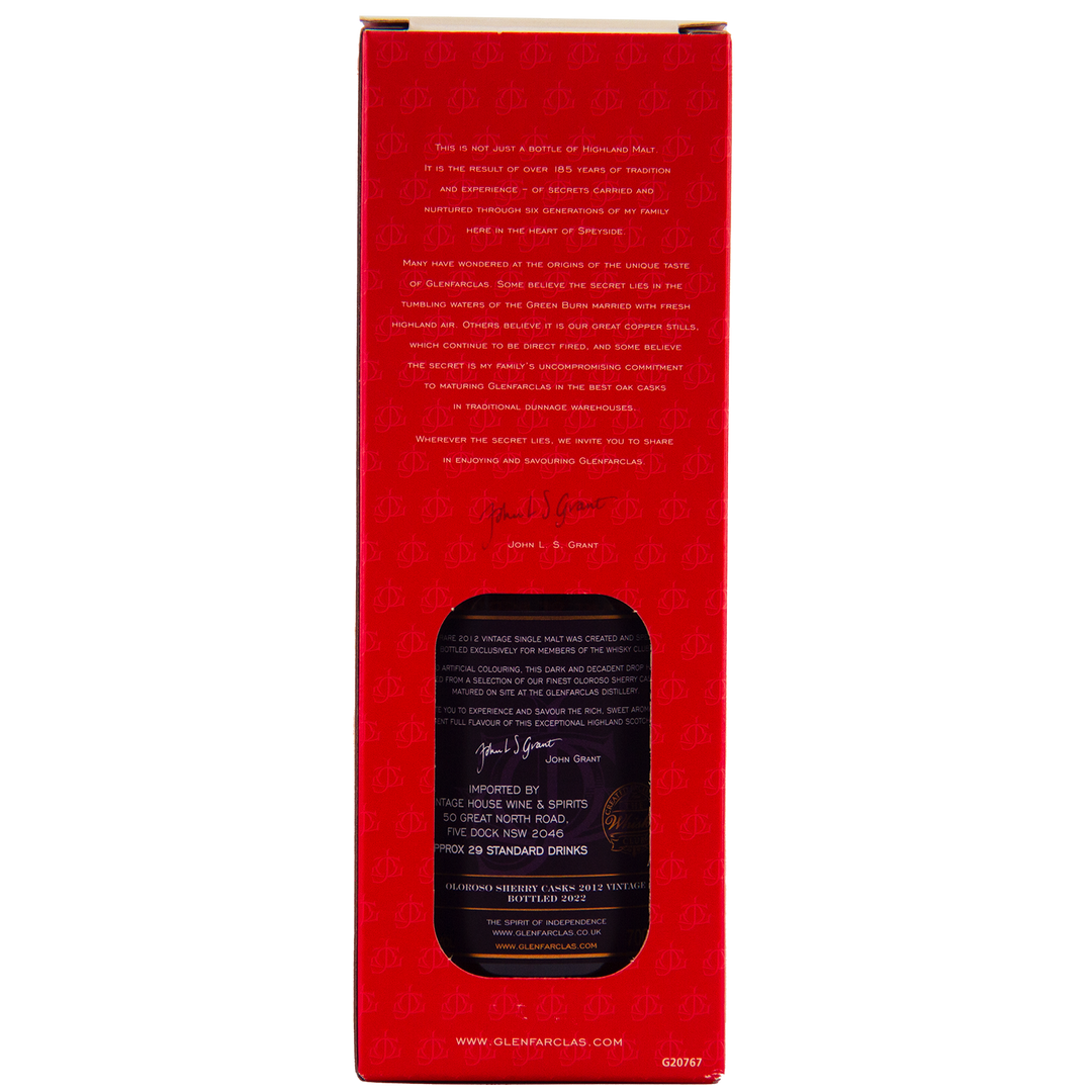 A red box with a cut-out window displays the Glenfarclas Oloroso Sherry Casks 2012 Vintage bottle. Gold and white text, a signature, and subtle patterns accentuate this Speyside single malt whisky packaging.