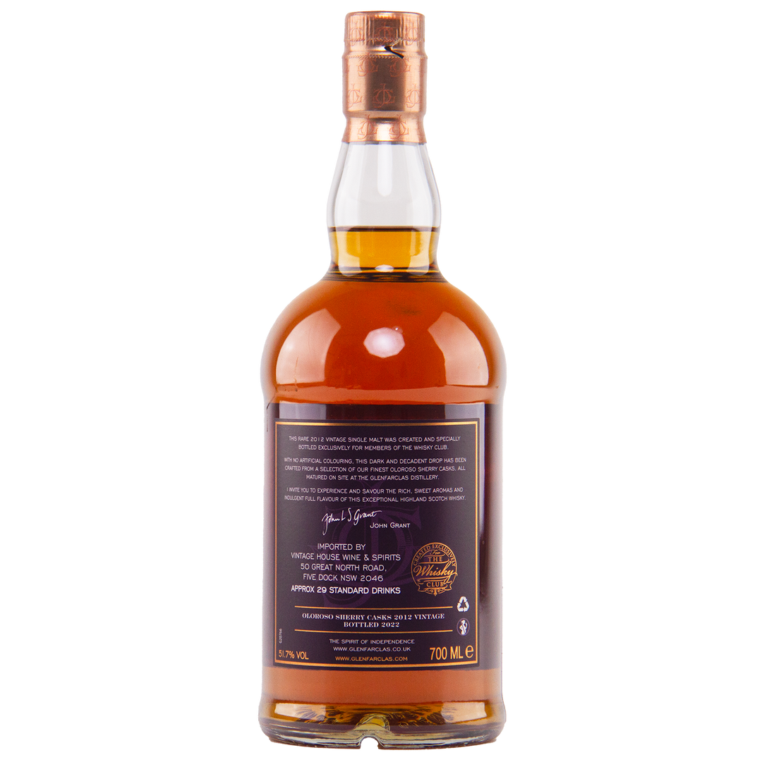 A bottle of Glenfarclas Oloroso Sherry Casks 2012 Vintage single malt whisky with a copper cap, amber liquid, and a back label displaying 700 ml, 43% ABV, signature text, and cask details.