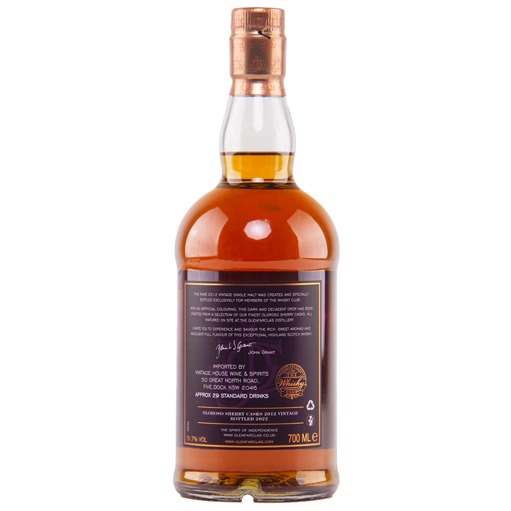 A bottle of Glenfarclas Oloroso Sherry Casks 2012 Vintage single malt whisky with a copper cap, amber liquid, and a back label displaying 700 ml, 43% ABV, signature text, and cask details.