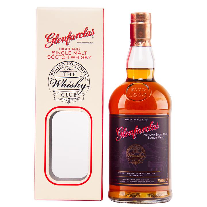 A bottle of Glenfarclas Oloroso Sherry Casks 2012 Vintage sits beside its cream and red box, which features “The Whiskey Club” branding and a cut-out displaying this Speyside single malt whisky.