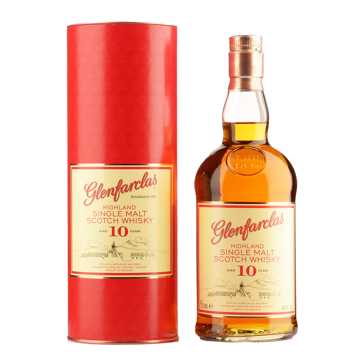 A bottle of Glenfarclas 10 Year Old Single Malt Scotch Whisky stands beside its red cylindrical box, both with cream and gold labels featuring red lettering and emphasizing its sherry cask maturation.