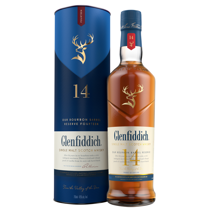 A bottle of Glenfiddich 14 Year Old Bourbon Barrel Reserve Single Malt Scotch Whisky stands beside its matching blue and gold cylindrical box, both displaying the stag logo and bourbon barrel reserve details.