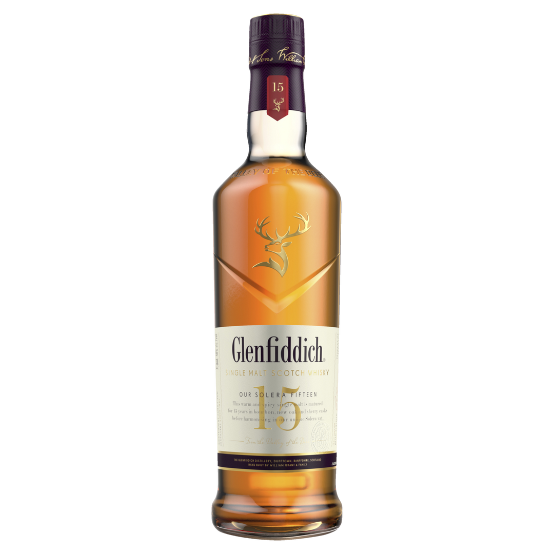 A bottle of Glenfiddich 15 Year Old Solera Reserve Single Malt Scotch Whisky featuring a maroon cap, gold stag logo, and cream-colored label displaying the brand and age.
