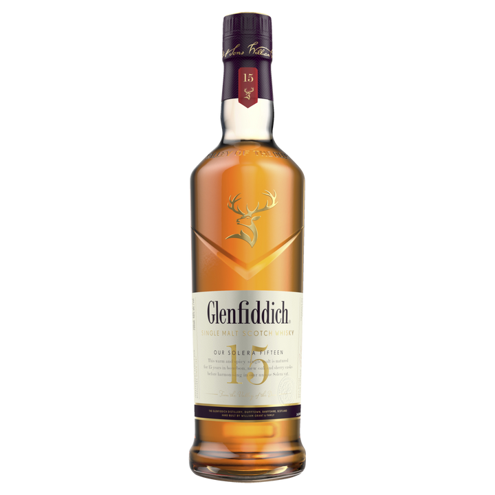 A bottle of Glenfiddich 15 Year Old Solera Reserve Single Malt Scotch Whisky featuring a maroon cap, gold stag logo, and cream-colored label displaying the brand and age.