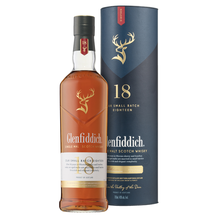 Glenfiddich 18 Year Old Single Malt Scotch Whisky stands beside its tall, dark blue cylindrical box, both displaying the iconic stag logo and gold text to showcase this premium single malt scotch.