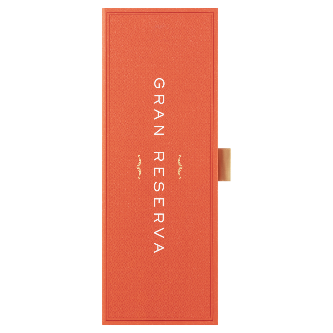 An orange rectangular box with "GRAN RESERVA" in white vertical letters and a gold tab on the right, designed for Glenfiddich 21 Year Old Gran Reserva Single Malt Scotch Whisky, finished in Caribbean rum casks.