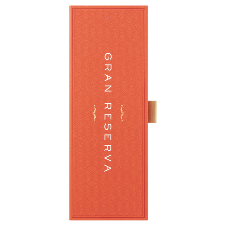 An orange rectangular box with "GRAN RESERVA" in white vertical letters and a gold tab on the right, designed for Glenfiddich 21 Year Old Gran Reserva Single Malt Scotch Whisky, finished in Caribbean rum casks.
