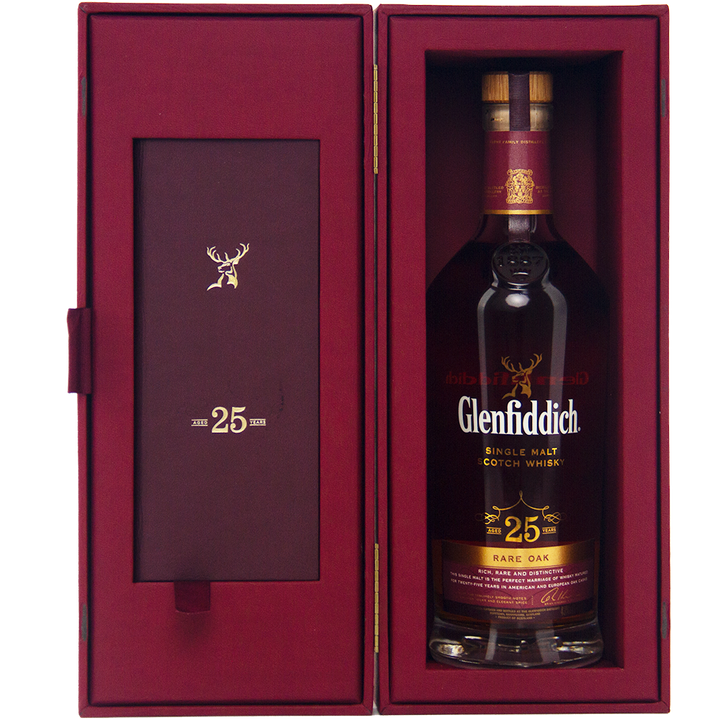 Glenfiddich 25 Year Old Rare Oak Single Malt Scotch Whisky from Speyside, presented in a maroon box with a gold stag logo and “25” on the inside cover. The label celebrates its distinguished Rare Oak character.