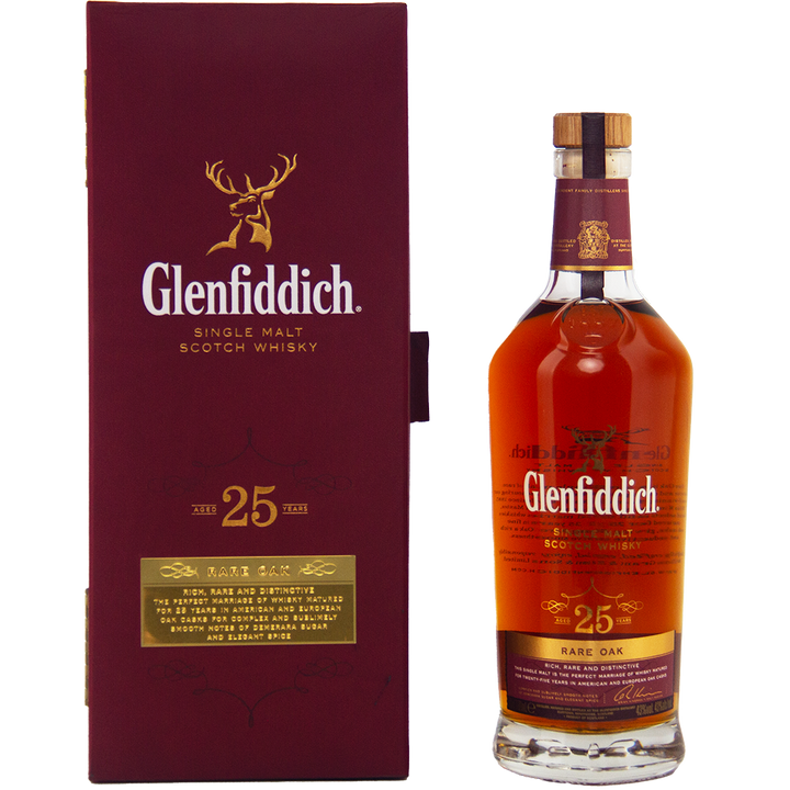 A bottle of Glenfiddich 25 Year Old Rare Oak Single Malt Scotch Whisky rests beside its maroon box, featuring gold lettering and the stag logo, showcasing the distinguished age and rarity of this exceptional Speyside whisky.