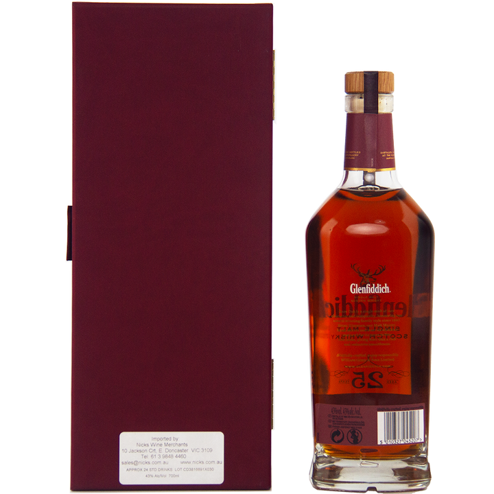 A bottle of Glenfiddich 25 Year Old Rare Oak Single Malt Scotch Whisky with a rich amber hue stands beside its tall, burgundy Speyside box. The bottle has a cork stopper and detailed gold labeling.
