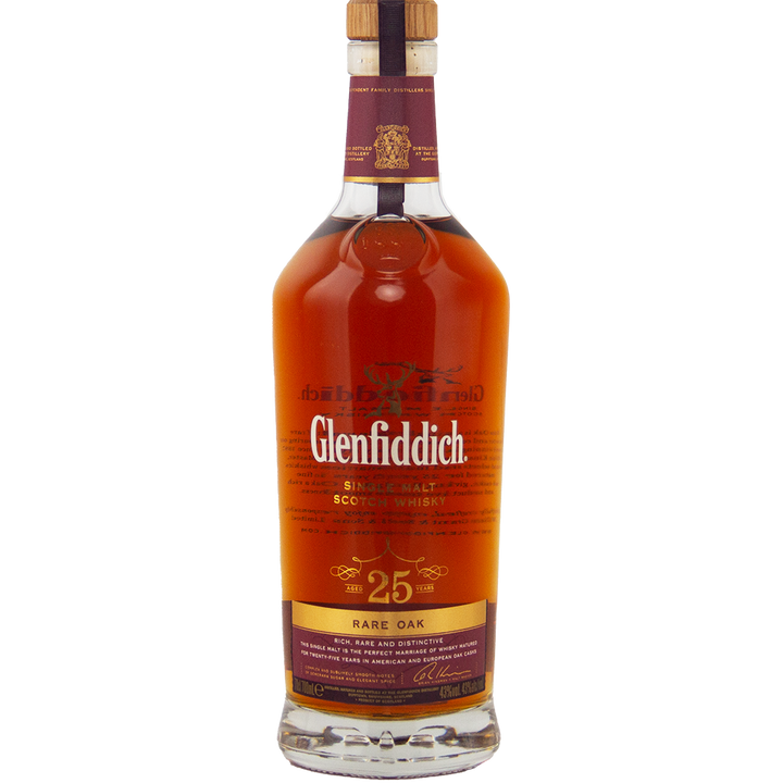 A bottle of Glenfiddich 25 Year Old Rare Oak Single Malt Scotch Whisky with a maroon and gold label, wooden cap, and amber liquid, set against a white background—a refined Speyside single malt.