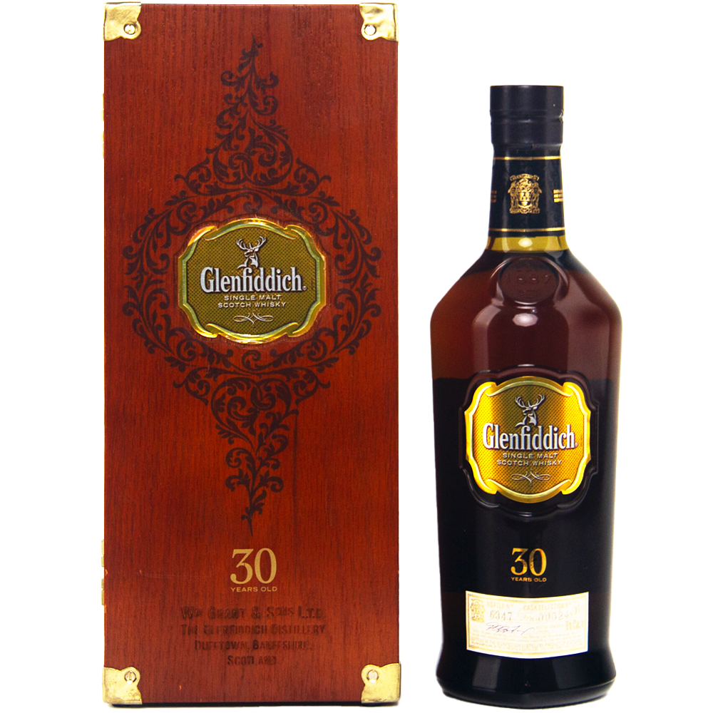 A bottle of Glenfiddich 30 Year Old Single Malt Scotch Whisky stands beside its ornate wooden box, both with gold labels and intricate detailing from the acclaimed Speyside distillery.