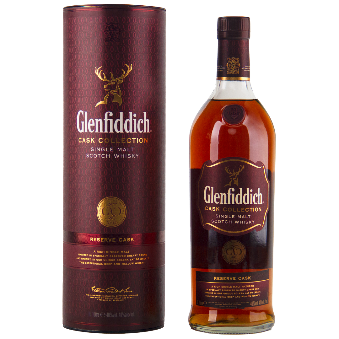 A bottle of Glenfiddich Cask Collection Reserve Cask Single Malt Scotch Whisky stands beside its maroon cylindrical box, both adorned with gold and orange accents and a stag logo—crafted using Solera vat maturation for exceptional depth.