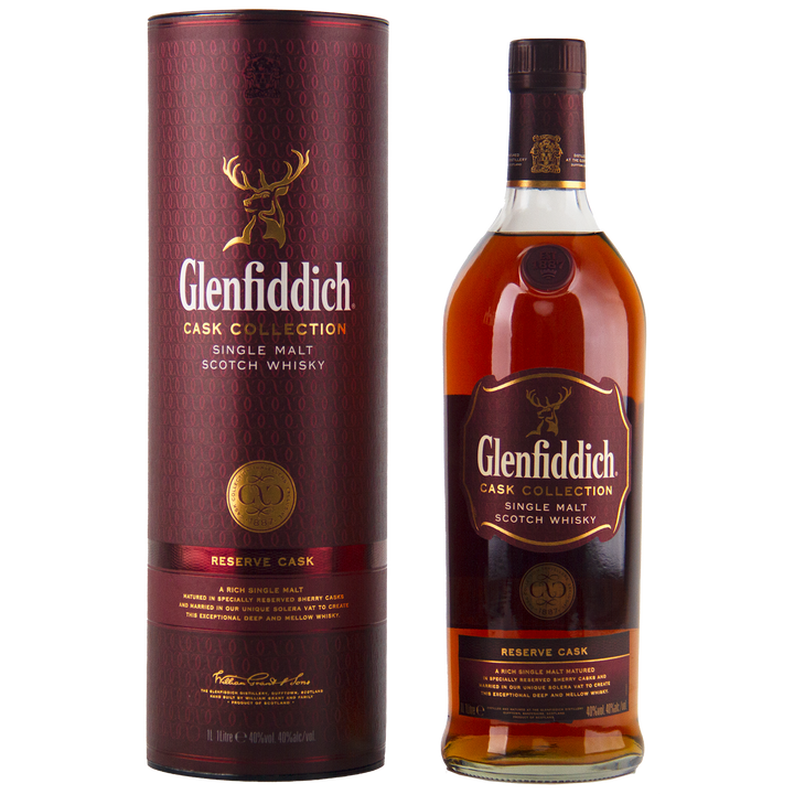 A bottle of Glenfiddich Cask Collection Reserve Cask Single Malt Scotch Whisky stands beside its maroon cylindrical box, both adorned with gold and orange accents and a stag logo—crafted using Solera vat maturation for exceptional depth.