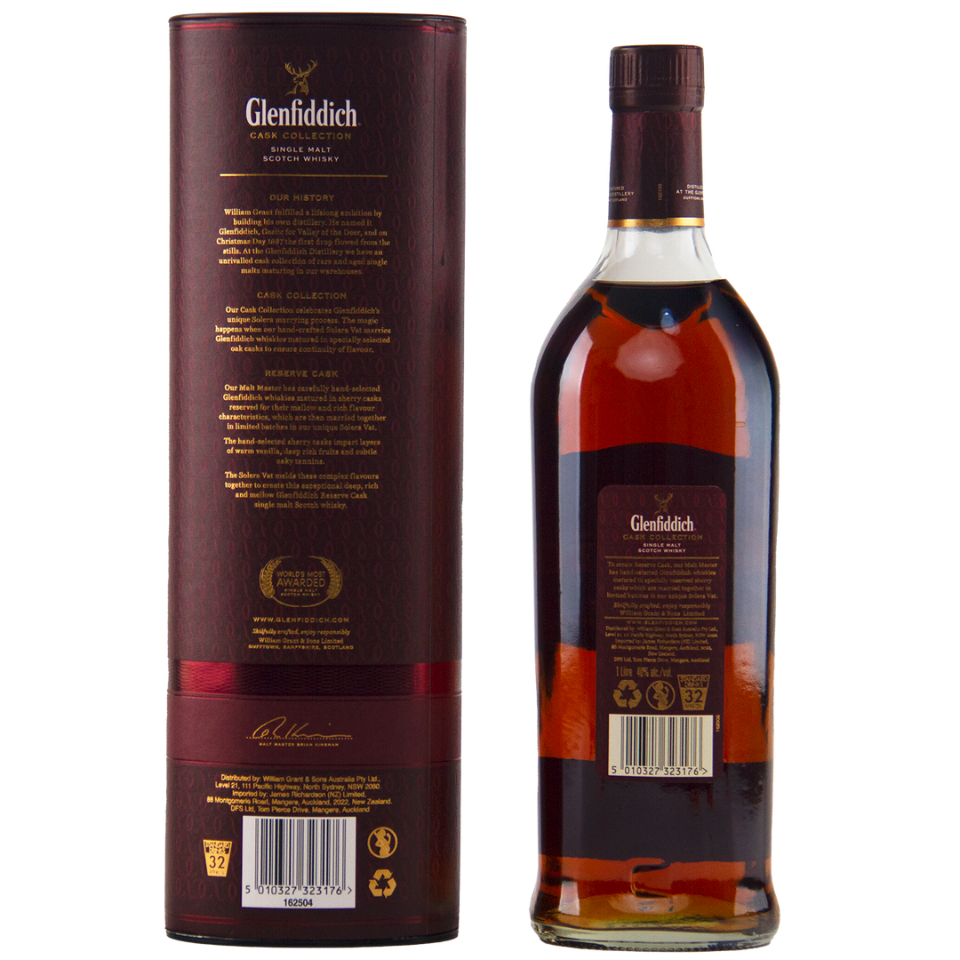 A Glenfiddich Cask Collection Reserve Cask Single Malt Scotch Whisky is shown with its matching dark red cylindrical box, both decorated with gold and white text and details, set against a plain background.