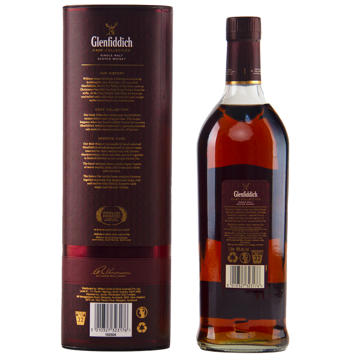 A Glenfiddich Cask Collection Reserve Cask Single Malt Scotch Whisky is shown with its matching dark red cylindrical box, both decorated with gold and white text and details, set against a plain background.