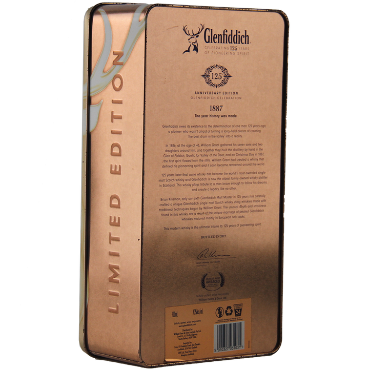 A metallic tin box of Glenfiddich 125th Anniversary Edition Single Malt Scotch Whisky, matured in European oak casks, features a stag logo, anniversary details, historical text, and "Limited Edition" written vertically.