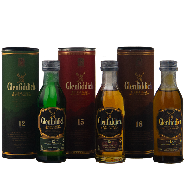 The Glenfiddich 12, 15, 18 Triple Pack Single Malt Scotch Whisky (3 x 50ml) is displayed with its matching cylindrical packaging, highlighting this elegant whisky gift set on a white background.