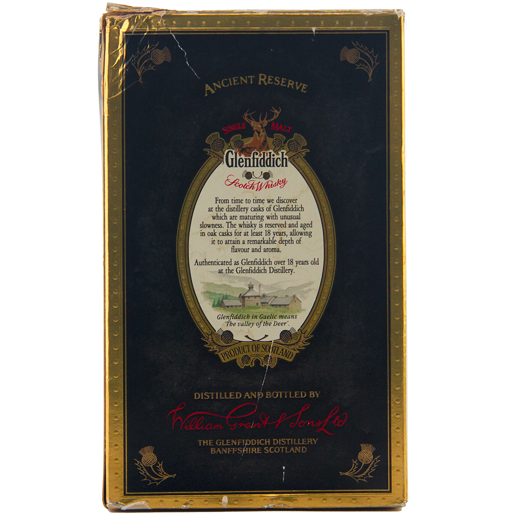 Back of a Glenfiddich 18 Year Old Ancient Reserve Single Malt Scotch Whisky box, with gold and red borders, an oval label detailing this limited edition drink, and distillers’ signatures at the bottom.