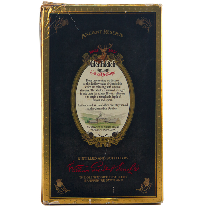 Back of a Glenfiddich 18 Year Old Ancient Reserve Single Malt Scotch Whisky box, with gold and red borders, an oval label detailing this limited edition drink, and distillers’ signatures at the bottom.