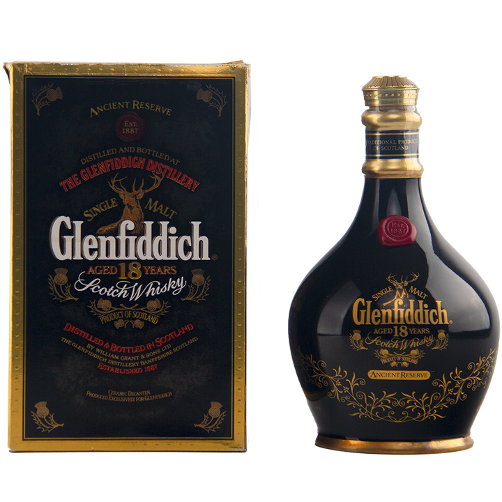 A Glenfiddich 18 Year Old Ancient Reserve Single Malt Scotch Whisky bottle and matching box, both in black with gold accents and elegant detailing. The rounded bottle shape makes it a standout piece for any collectible decanter set.