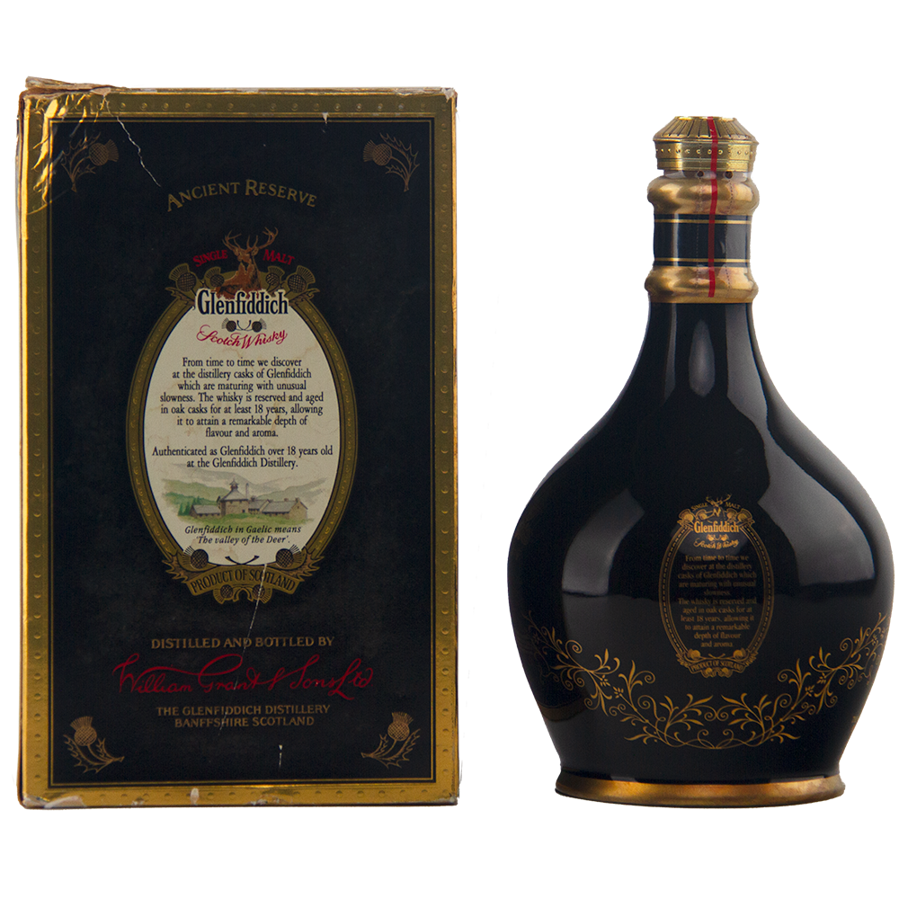 A dark, round Glenfiddich 18 Year Old Ancient Reserve Single Malt Scotch Whisky bottle with gold and red accents stands beside its matching black and gold box featuring elegant text and ornate designs.