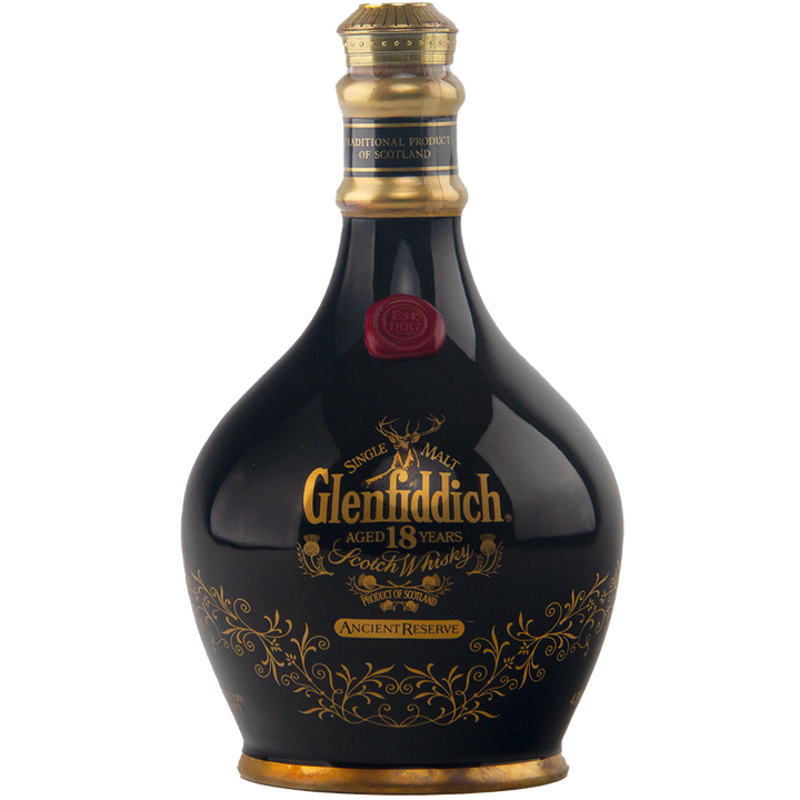 The Glenfiddich 18 Year Old Ancient Reserve Single Malt Scotch Whisky comes in a dark, ornate bottle with gold and red accents—a collectible decanter perfect for limited edition whisky enthusiasts.