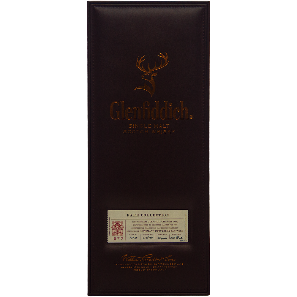 A rectangular Glenfiddich 40 year old 1977 Rare Vintage Single Malt Scotch Whisky box, dark brown with copper lettering and a stag logo, highlights its status as a rare vintage single malt.