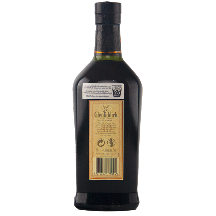 A rear view of a Glenfiddich 40 Year Old Single Malt Scotch Whisky bottle displays the label, barcode, and a tamper-evident black cap, all set against a plain white background.