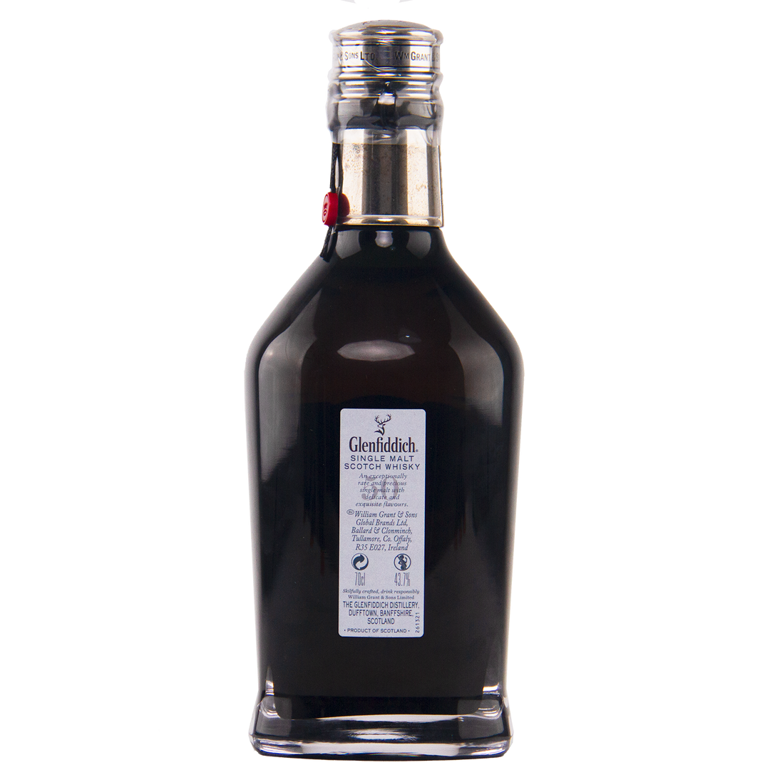A dark glass bottle of Glenfiddich 50 Year Old Single Malt Scotch Whisky (Third Edition) with a silver cap and detailed label stands against a plain white background, showcasing the exclusivity of this rare Speyside whisky.