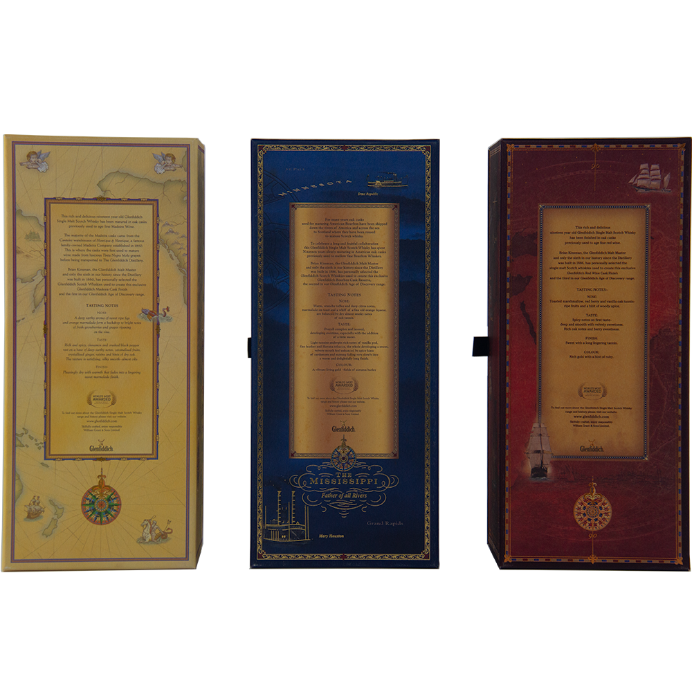 Three upright rectangular boxes—yellow, blue, and red—adorned with gold accents and intricate designs, gracefully present the Glenfiddich Age of Discovery Collection Single Malt Scotch Whisky.